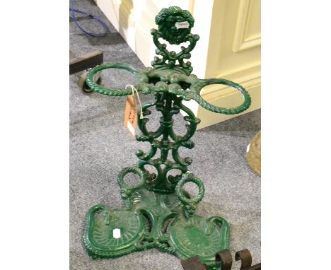 A green painted cast iron stick stand