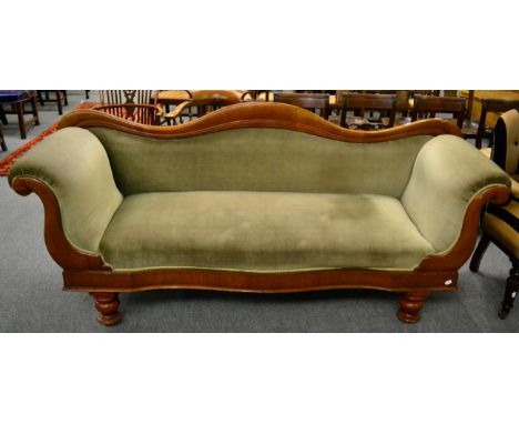 A Victorian mahogany framed humpback scroll end serpentine fronted sofa