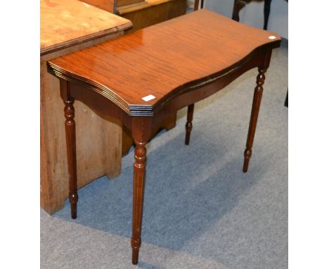 A reproduction leather topped fold over table and a reproduction sofa table