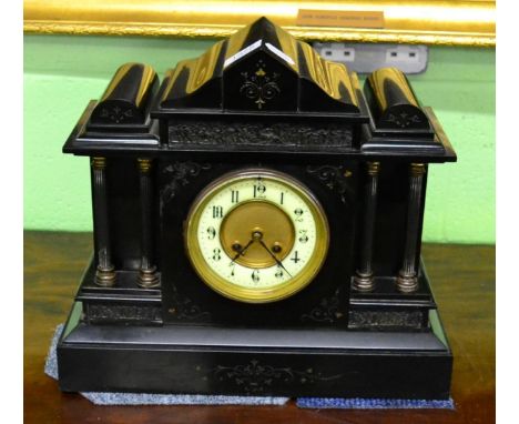 A slate mantel clock of architectural form