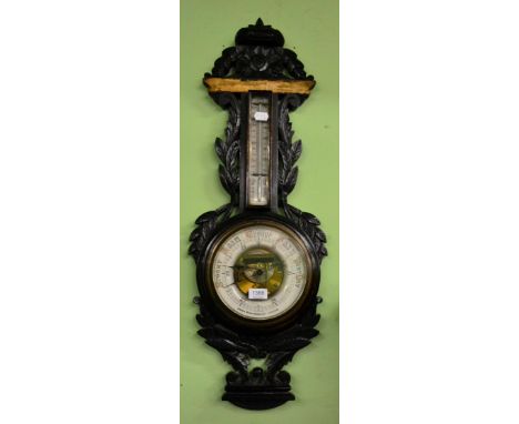 A carved oak barometer, Owen Robinson Ltd, Leeds (a.f.) and six various framed articles including one landscape watercolour, 