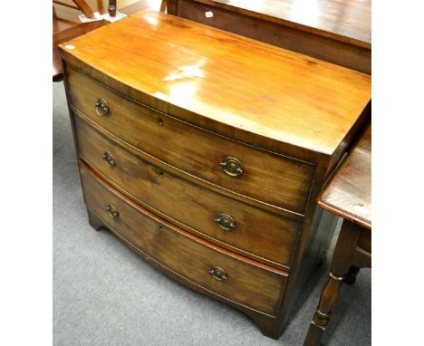 A bow fronted mahogany three height chest of drawers