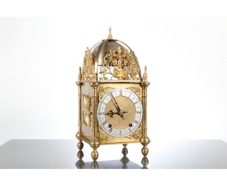 19TH CENTURY CONTINENTAL BRASS QUARTER STRIKING LANTERN CLOCK
with silvered Roman chapter, the movement stiking on two bells,