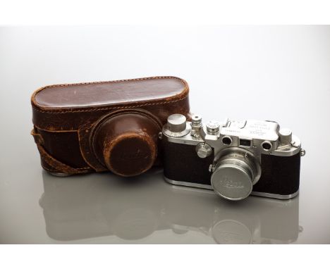 ERNST LEITZ LEICA CAMERA 
no.468544, with f5 1:3.5 lens, 14.5cm long, inside original fitted leather Leica case