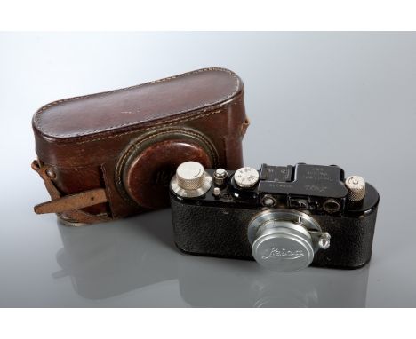 1930'S LEICA II CAMERA
with black frame and Leitz Elmar f 3.5 1:35 lens and tan case, serial no.88215