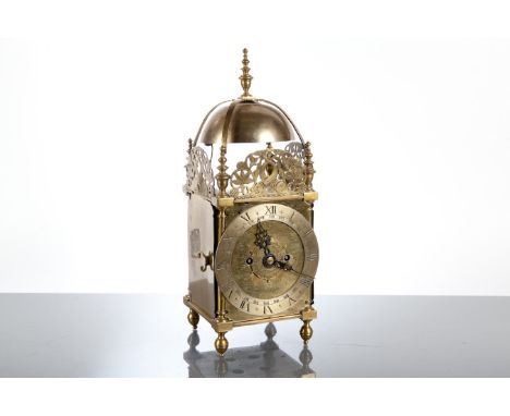 VICTORIAN BRASS LANTERN CLOCK
the Roman dial with fine floral engraving and chapter, the twin chain driven fusee movement str