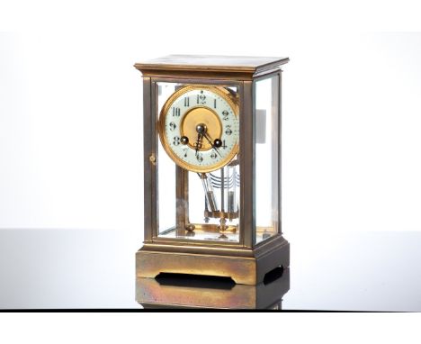 LATE 19TH CENTURY FRENCH BRASS FOUR GLASS CLOCK
with enamel Arabic dial, and mercury pendulum, the cylinder movement striking