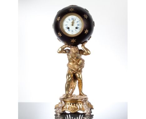 EARLY 20TH CENTURY GILT SPELTER MANTEL CLOCK
in the form of Apollo holding aloft a starred globe, with enamel blue Roman nume