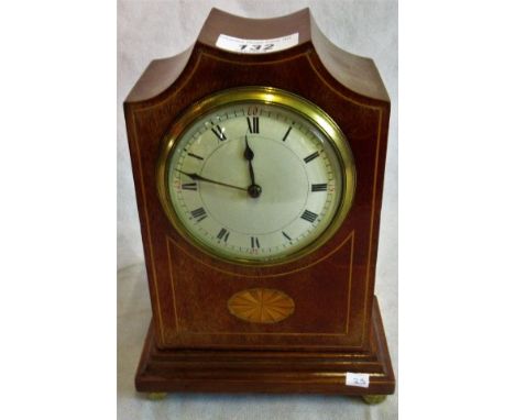 An Edwardian mahogany and shell inlaid mantle clock.