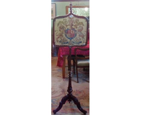 A Victorian mahogany pole screen, having woolwork panel on a tripod base. Condition Report: Tripod base lose at the joints.  