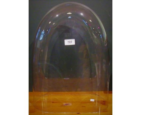 An early 20th century glass clock dome. Condition Report: 460mm High.  370mm Wide &amp; 140mm Deep.