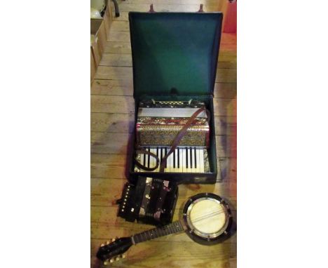 A cased accordion by Vissimio, together with a smaller accordion and a banjolele.