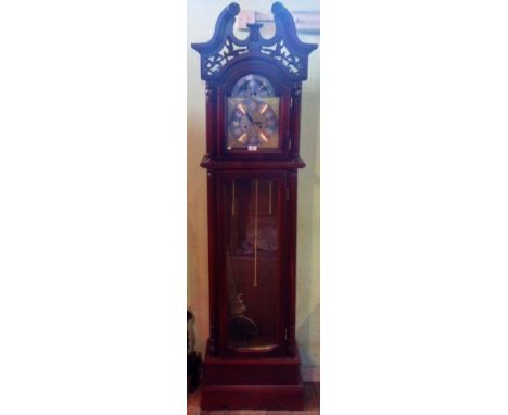 A reproduction mahogany longcase clock.