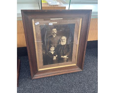 Large vintage wooden framed family portrait measures approx 28 inches wide by 33 inches tall 
