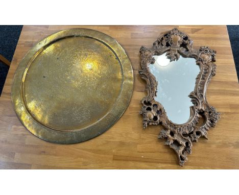 Vintage gilt framed mirror and a brass charger- largest measures 23 inches diameter 