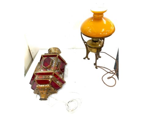 Vintage converted oil lamp with brass base and a wall hanging light 