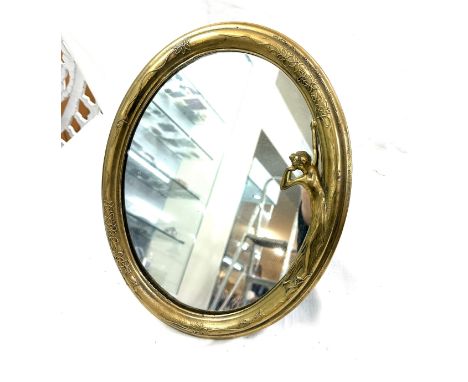 Art deco style brass framed oval mirror measures approx 14 inches tall 