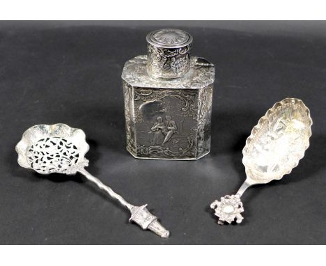 A Victorian silver tea caddy, the body decorated with courting couples in pastoral setting, the lid depicting frolicking cher