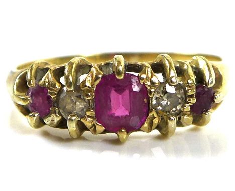 An 18ct gold ruby and diamond five stone ring, the central ruby of 4.8mm, size P, 2.7g.