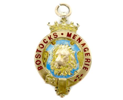 An Edward VII 9ct gold medallion, of circular form with a central relief cast and pale blue enamelled shield depicting a lion