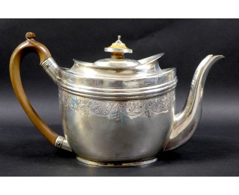 A George III silver teapot, with bright cut engraving, ivory finial and fruitwood handle, Solomon Hougham, London 1802, 27 by