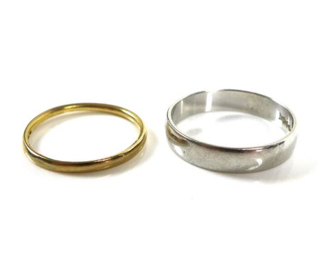 A platinum wedding band, marked 950, size O, 4g, and a gold wedding band, indistinctly marked 22ct, size K, 1.3g. (2) 