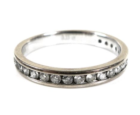 A half eternity ring, the white 9ct gold band set with twenty small diamonds, total diamond weight 0.33ct, size K, 2.1g. 