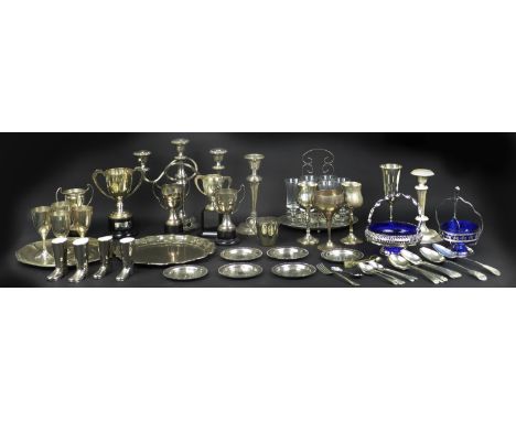 A silver candlestick, with weighted circular base, Williams Ltd. Birmingham, 1914, 11 by 21cm high, and a collection of silve