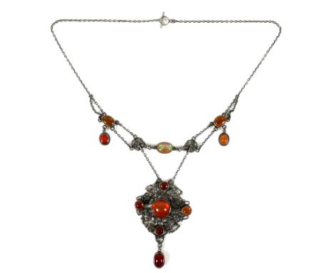 An Edwardian design carnelian necklace, set with carnelian cabochons and an orange opal within a floral openwork white metal 