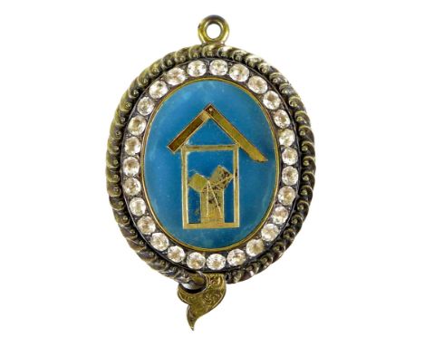 A Victorian unusual paste Masonic jewel, of oval form, with Masonic tools to a blue ground, surrounded by twenty seven paste 
