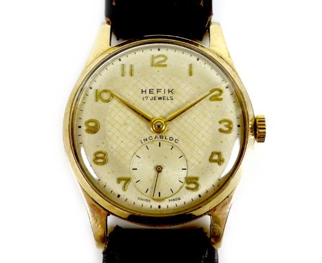 A Hefix 9ct gold cased gentleman's wristwatch, circa 1950s, circular silvered dial, raised gold Arabic numerals and recessed 