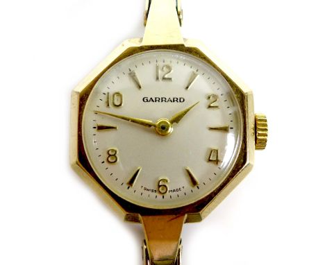 A Garrard 9ct gold lady's wristwatch, circa 1969, with octagonal case, circular silvered dial with raised gold Arabic numeral