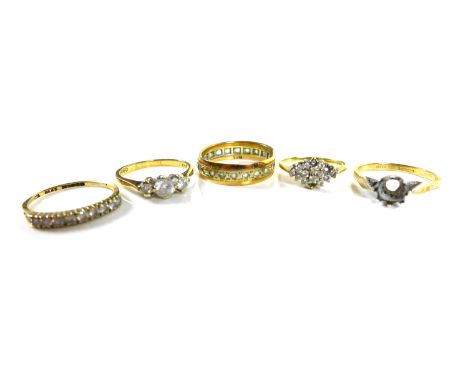 Four 9ct gold dress rings, including a three white stone ring, size M/N, a cluster white stone ring, size I/J, a white stone 