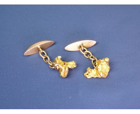 9CT GOLD PLAIN PEAR SHAPED CUFFLINKS - each with a four link chain to a believed uncut gold nugget, total 11.5grms