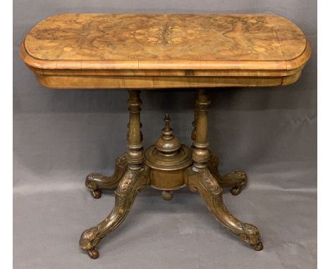 VICTORIAN WALNUT FOLDOVER CARD TABLE - on turned and carved supports and central urn finial on brown pot castors, 74cms H, 95