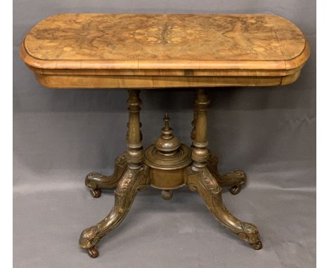 VICTORIAN WALNUT FOLDOVER CARD TABLE - on turned and carved supports and central urn finial on brown pot castors, 74cms H, 95