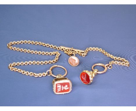A 9CT GOLD CHAIN - with three amber seals and with T bar, 64grms total