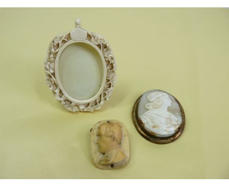SHELL CARVED CAMEO IN GILT METAL MOUNT, bone carved brooch, possibly Napoleon, and a carved ivory portrait frame with easel s