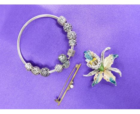 A PANDORA 925 SILVER BANGLE - 38.9grms in original Pandora box and an orchid and enamel white metal brooch and a yellow metal