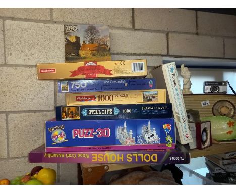 A good mix of vintage jigsaws, 3D puzzle and wooden dolls house kit