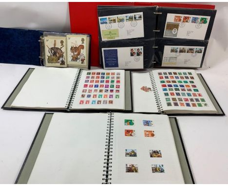 A collection of stamps - UK, Commonwealth and World - contained in three albums; 1970's and 1980's first day covers and some 