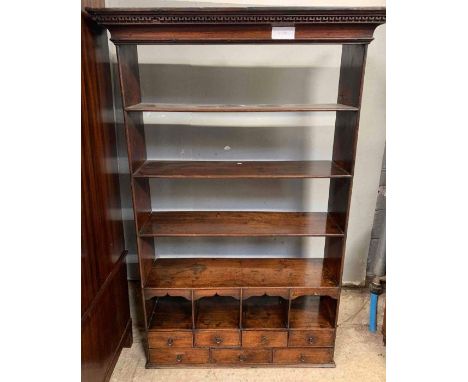 A Victorian open hanging shelf, with four open shelf sections, four smaller open sections and seven short drawers, 127cm high