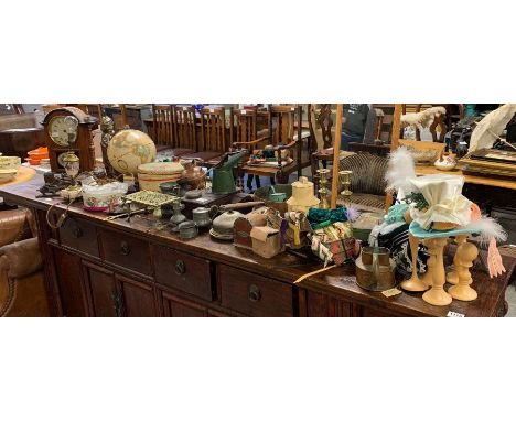 A collection of miscellaneous items including a mantel clock, globe on stand, brassware, modern miniature hat stands from the