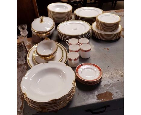 A set of eight Royal Crown Derby soup bowls, each with gilded rims, along with Royal Worcester part dinner in "Somerset" patt