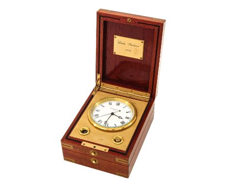 Patek Philippe, marine chronometer, Naviquartz 1215, numbered 1.801.284, in a mahogany box with brass fittings. With a plaque
