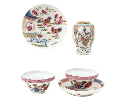 Including 2 cups and saucers and a small tea box in Famille Rose decors, 10 cm. tall with restoration on rim.