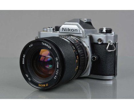 A Nikon FM SLR Camera, chrome, shutter working, meter responsive, self timer working, film advance lever slow to return, body