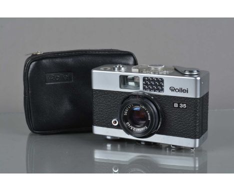 A Rollei B 35 Compact Camera, made in Singapore, shutter working, light cell responsive, body G-VG, tiny ding to bottom edge 