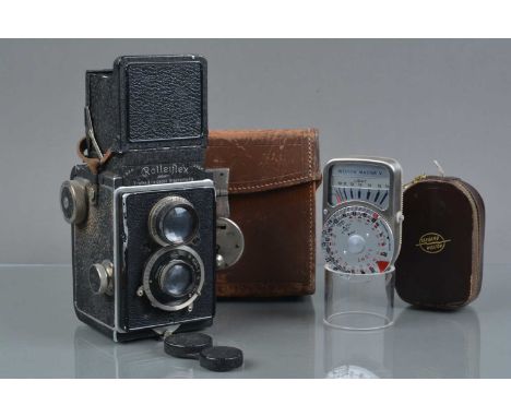 A Rolleiflex I TLR Camera, serial no 34871, shutter sticking in slow speeds, body F, ding to front edge, paint wear to edges,