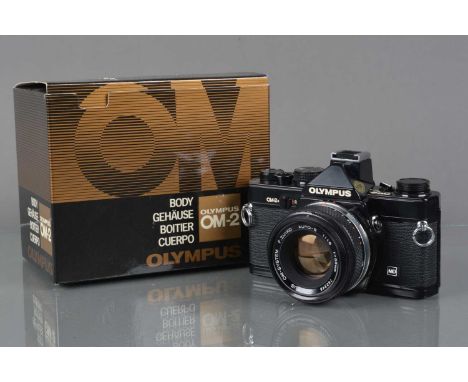 An Olympus OM-2n MD SLR Camera, black, shutter working, meter responsive, responsive in auto, self time working, body G, film